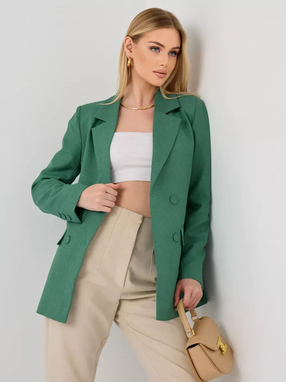 Model wearing a Verde Blazer by Lauven, an oversized double-breasted green tailored jacket paired with neutral high-waisted pants.