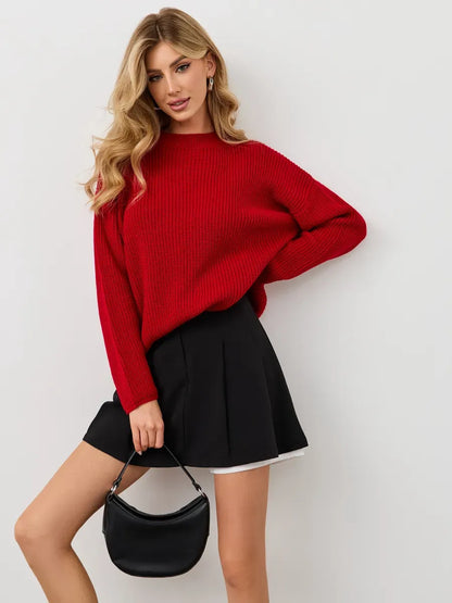 Viona Sweater by Lauven - Oversized red knit pullover with crew neck, styled with a black skirt and handbag.